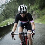 female race cyclist on mountain road